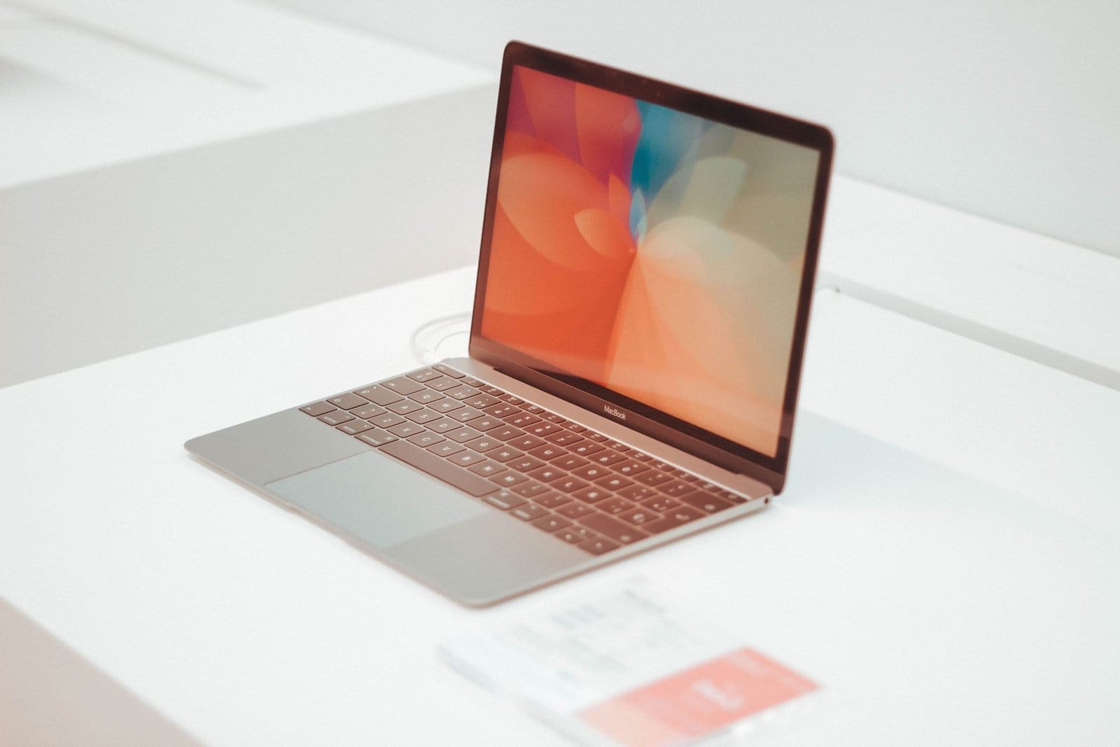 An open laptop on a white desk